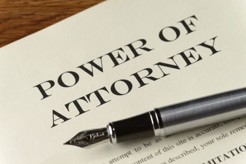 Power of Attorney legal document with fountain pen.